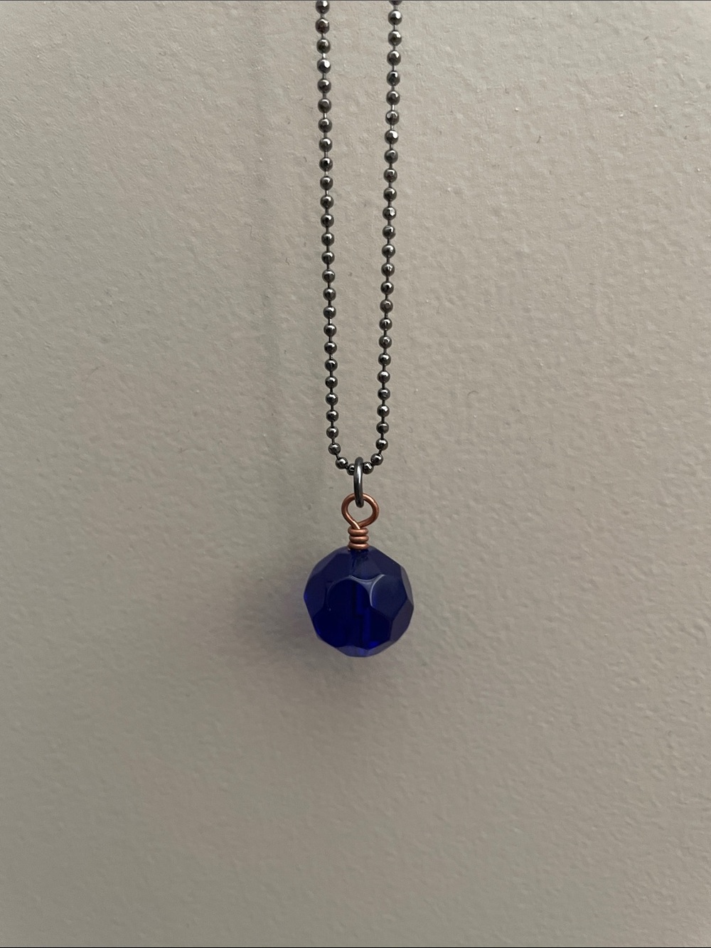 Mixed metal blue glass necklace